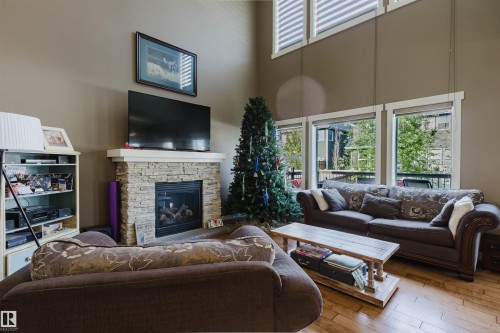 173 Sheppard Circle, Leduc, AB - Indoor Photo Showing Living Room With Fireplace