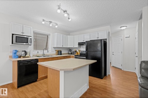 97 2021 Grantham Court Nw, Edmonton, AB - Indoor Photo Showing Kitchen With Double Sink