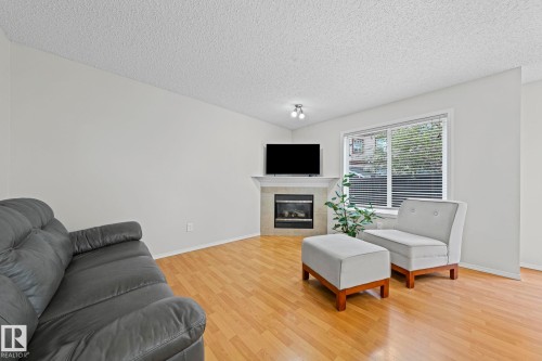 97 2021 Grantham Court Nw, Edmonton, AB - Indoor Photo Showing Living Room With Fireplace