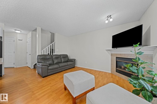97 2021 Grantham Court Nw, Edmonton, AB - Indoor Photo Showing Living Room With Fireplace