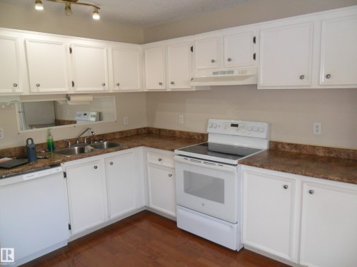 #66 8930 99 Av, Fort Saskatchewan, AB - Indoor Photo Showing Kitchen With Double Sink