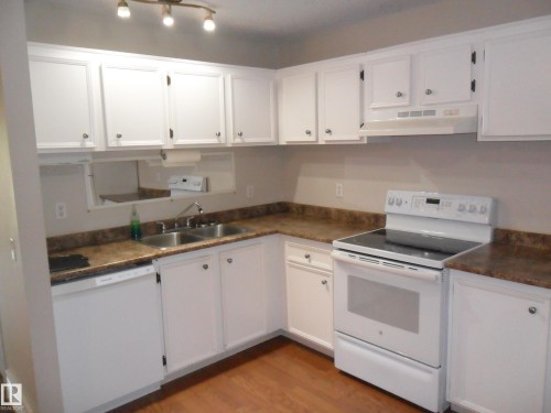 #66 8930 99 Av, Fort Saskatchewan, AB - Indoor Photo Showing Kitchen With Double Sink