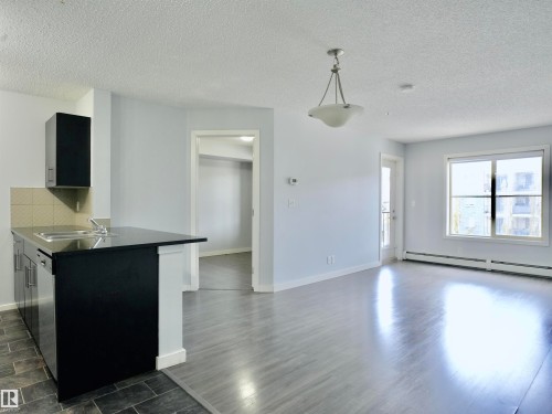 320 5816 Mullen Place, Edmonton, AB - Indoor Photo Showing Kitchen With Double Sink