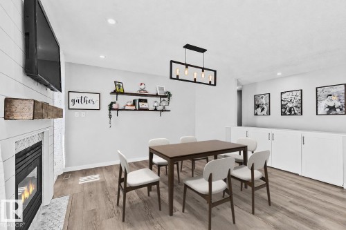 3205 41A Avenue, Edmonton, AB - Indoor Photo Showing Dining Room With Fireplace