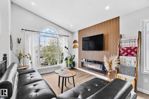 3205 41A Avenue, Edmonton, AB - Indoor Photo Showing Living Room With Fireplace