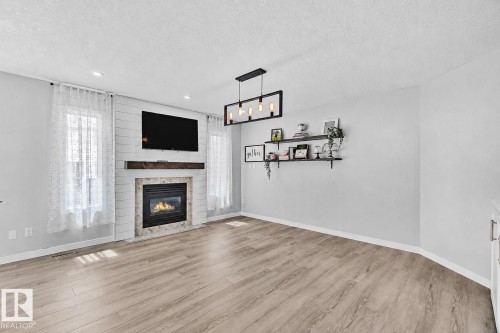 3205 41A Avenue, Edmonton, AB - Indoor Photo Showing Living Room With Fireplace
