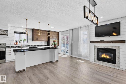 3205 41A Avenue, Edmonton, AB - Indoor Photo Showing Other Room With Fireplace
