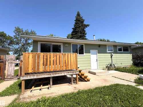Room featuring wood-finish flooring, recessed lighting, and a neutral color palette - 4418 45 Avenue, Bonnyville Town, AB 