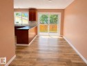 Kitchen featuring wood-finish flooring, recessed lighting, and a U-shaped layout - 4418 45 Avenue, Bonnyville Town, AB 