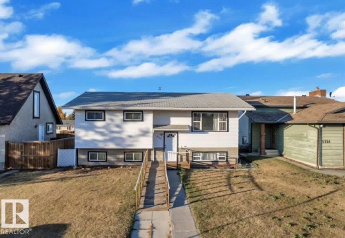Two-story residence featuring white siding and a light grey roof - 5118 17A Avenue Nw, Edmonton, AB - Outdoor