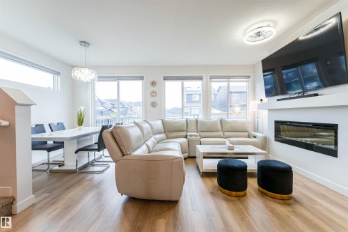 231 Orchards Boulevard, Edmonton, AB - Indoor Photo Showing Living Room With Fireplace