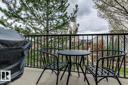 Outdoor balcony featuring a concrete surface and black metal railing - 67 603 Watt Boulevard, Edmonton, AB - Outdoor