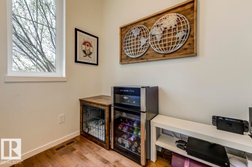 Hardwood-finish flooring with white baseboards - 67 603 Watt Boulevard, Edmonton, AB - Indoor