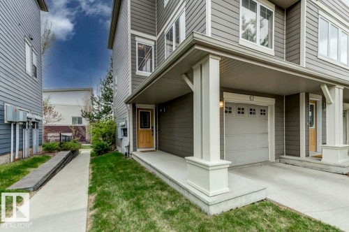 Gray siding exterior featuring white trim accents - 67 603 Watt Boulevard, Edmonton, AB - Outdoor With Exterior