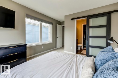 Bedroom featuring light gray carpet flooring and neutral wall tones - 67 603 Watt Boulevard, Edmonton, AB - Indoor Photo Showing Bedroom
