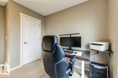 Neutral wall paint, white trim, and white two-panel interior door - 67 603 Watt Boulevard, Edmonton, AB - Indoor Photo Showing Office