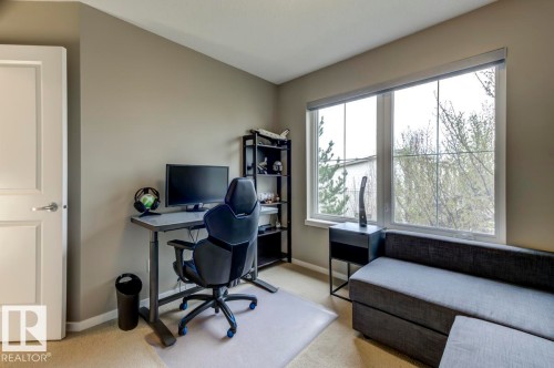 Interior room featuring light beige wall paint and carpeted flooring - 67 603 Watt Boulevard, Edmonton, AB - Indoor Photo Showing Office