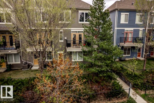 Multi-level townhome featuring a private balcony with black metal railing - 67 603 Watt Boulevard, Edmonton, AB - Outdoor