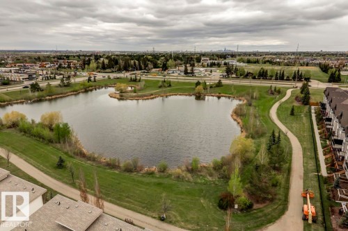 Expansive artificial lake surrounded by green space and walking paths - 67 603 Watt Boulevard, Edmonton, AB - Outdoor With Body Of Water With View