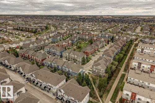 Expansive residential community featuring a variety of housing types, including single-detached homes, townhomes, and multi-story buildings - 67 603 Watt Boulevard, Edmonton, AB - Outdoor With View