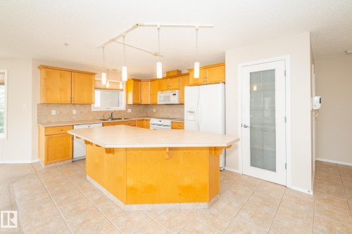 210 2420 108 Street, Edmonton, AB - Indoor Photo Showing Kitchen With Double Sink