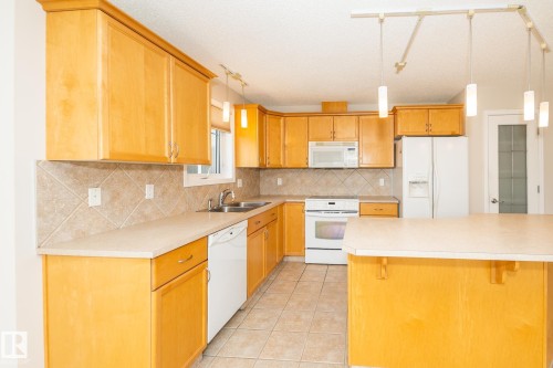 210 2420 108 Street, Edmonton, AB - Indoor Photo Showing Kitchen With Double Sink