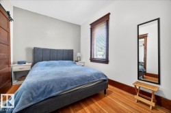 Hardwood flooring with prominent graining and a clear finish throughout - 