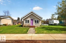 Stucco-finish exterior with a gabled roofline - 