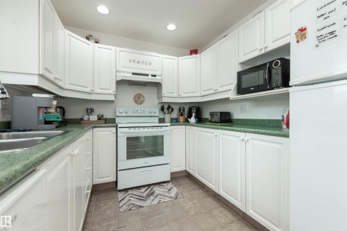 25 3645 145 Avenue, Edmonton, AB - Indoor Photo Showing Kitchen With Double Sink