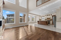 Spacious open-concept interior featuring high ceilings and abundant natural light - 