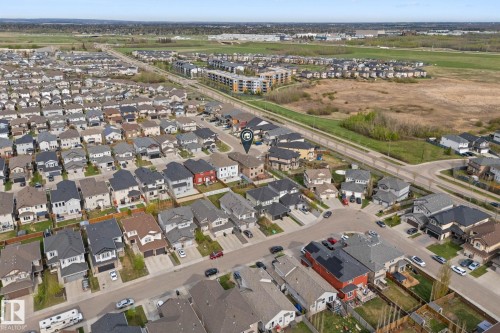 Aerial overview showcasing a residential neighborhood with diverse housing styles - 16543 132 Street, Edmonton, AB - 