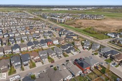Aerial overview showcasing a residential neighborhood with diverse housing styles - 