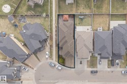 Aerial perspective showcasing a single-family residence with a multi-gabled roofline - 