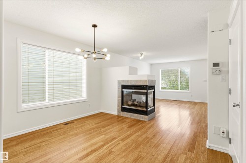 2550 Rabbit Hill Road, Edmonton, AB - Indoor Photo Showing Living Room With Fireplace