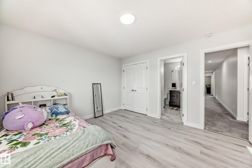 This room features light-colored flooring and white walls, creating a bright and airy atmosphere - 4509 170A Avenue, Edmonton, AB - Indoor Photo Showing Bedroom