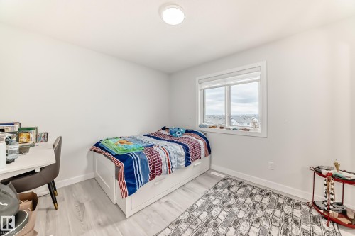 This room features light-colored flooring and white walls, creating a bright and airy atmosphere - 4509 170A Avenue, Edmonton, AB - Indoor Photo Showing Bedroom