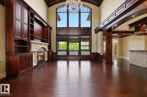 1004 Hollands Point(E), Edmonton, AB - Indoor Photo Showing Other Room With Fireplace