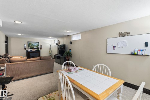 Versatile lower-level space featuring recessed lighting, light-toned walls, and carpet flooring - 15232 120 Nw, Edmonton, AB 