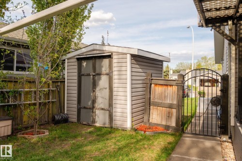 Utility shed with horizontal siding and a dual-panel door - 15232 120 Nw, Edmonton, AB 