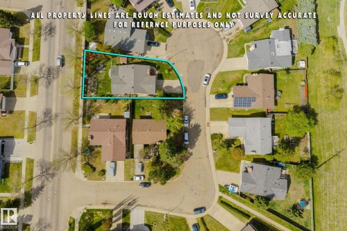 Single-story residence featuring a gray shingle roof and a green lawn - 15232 120 Nw, Edmonton, AB 