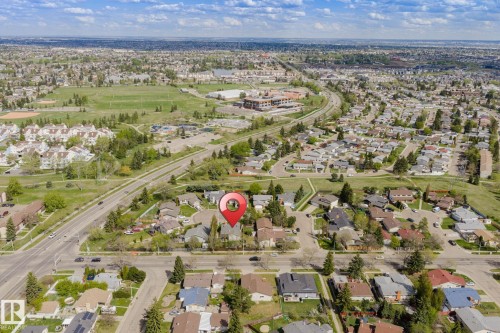 Aerial perspective showcasing a residential neighborhood with surrounding green spaces - 15232 120 Nw, Edmonton, AB 