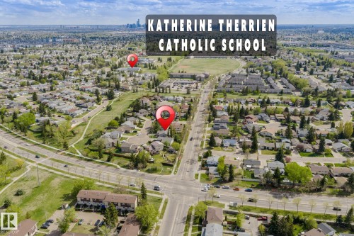 Aerial neighborhood overview featuring residential homes and green spaces - 15232 120 Nw, Edmonton, AB 