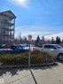 The property features a multi-story building with balconies, set against a clear blue sky - 209 7511 171 Street Nw, Edmonton, AB  - Outdoor 