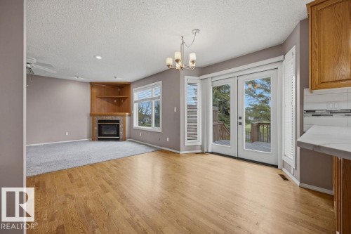10 Coloniale Court, Beaumont, AB - Indoor Photo Showing Other Room With Fireplace