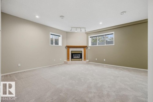 10 Coloniale Court, Beaumont, AB - Indoor With Fireplace