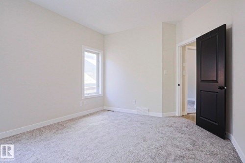Bright room featuring light grey carpeting and neutral wall tones - 82 Meadowview Point(E), Sherwood Park, AB - Indoor Photo Showing Other Room
