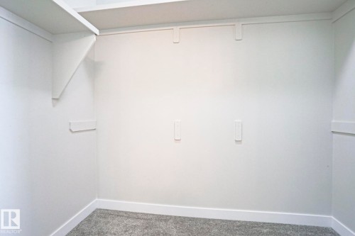 Built-in shelving and white wall finishes - 82 Meadowview Point(E), Sherwood Park, AB - Indoor