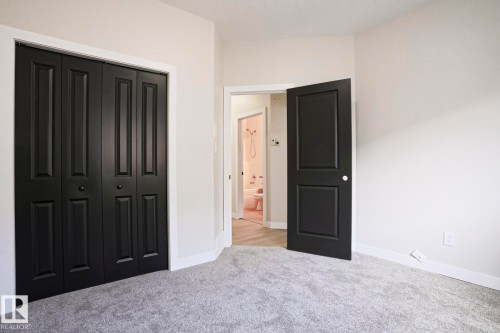 Interior room featuring light gray carpet, white walls, and white baseboards - 82 Meadowview Point(E), Sherwood Park, AB - Indoor