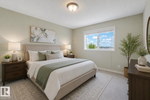 Neutral-toned bedroom featuring wall-to-wall carpeting and a recessed ceiling light fixture - 3534 Mclean Crescent, Edmonton, AB - Indoor Photo Showing Bedroom