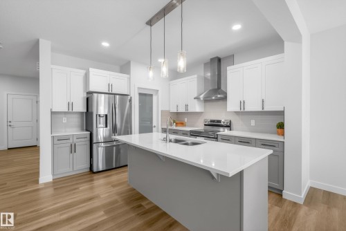 9309 Pear Link Link, Edmonton, AB - Indoor Photo Showing Kitchen With Stainless Steel Kitchen With Double Sink With Upgraded Kitchen